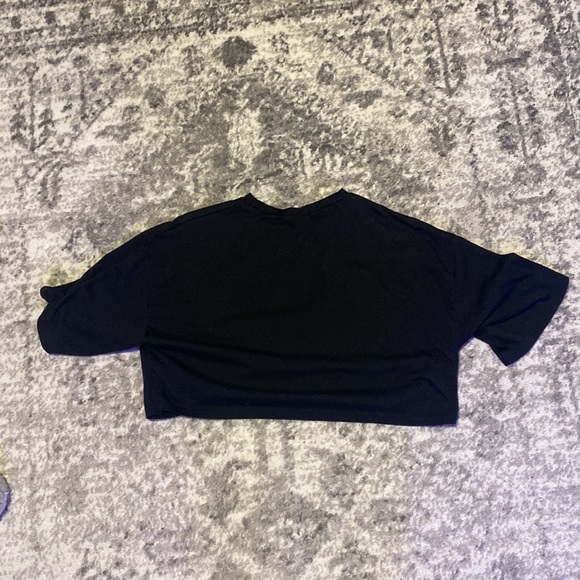I am selling a cropped black t-shirt in a size small with text written on front. - Picture 2 of 2